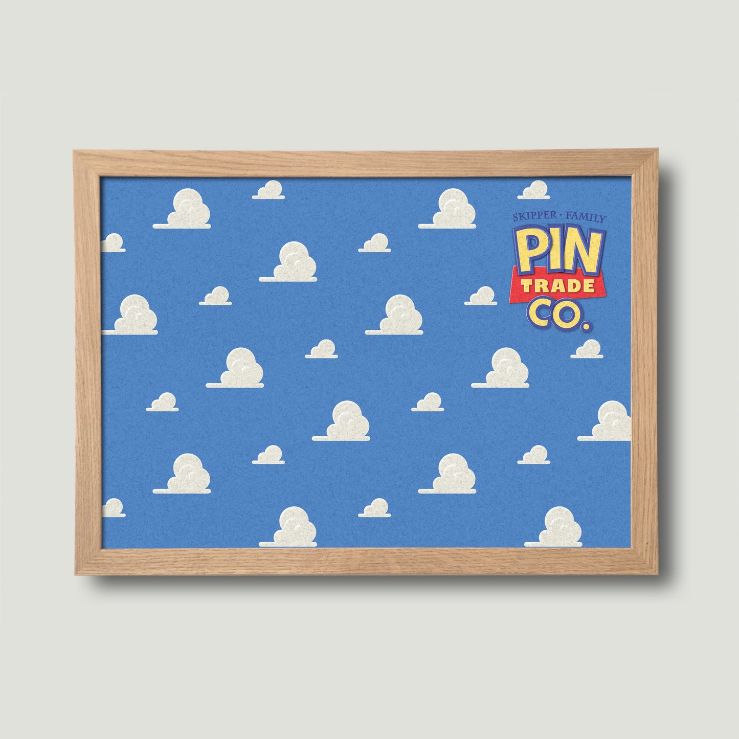 landscape version of wooden framed pin board with blue sky and clouds design in background. Toyistory themed graphic.