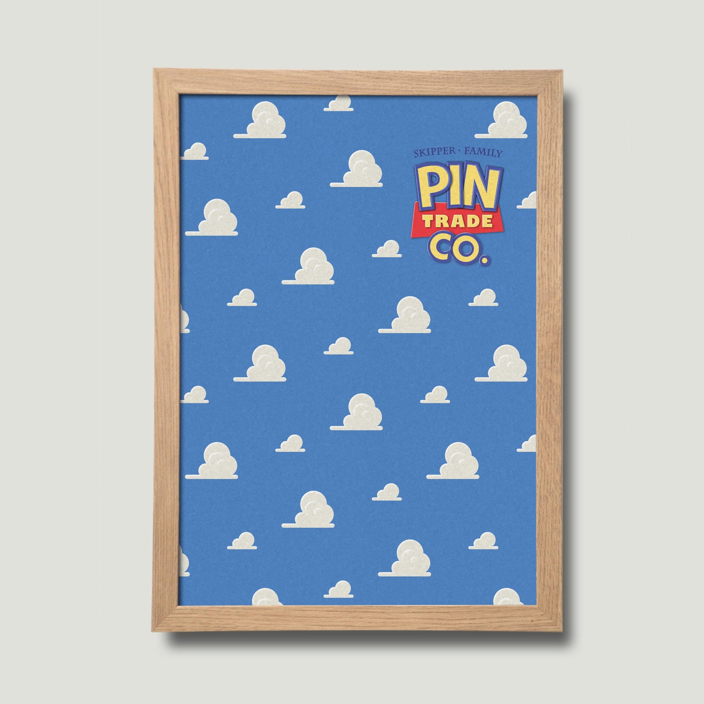 framed in natural wood, cork pin trading board displays andys room wallpaper in the background.