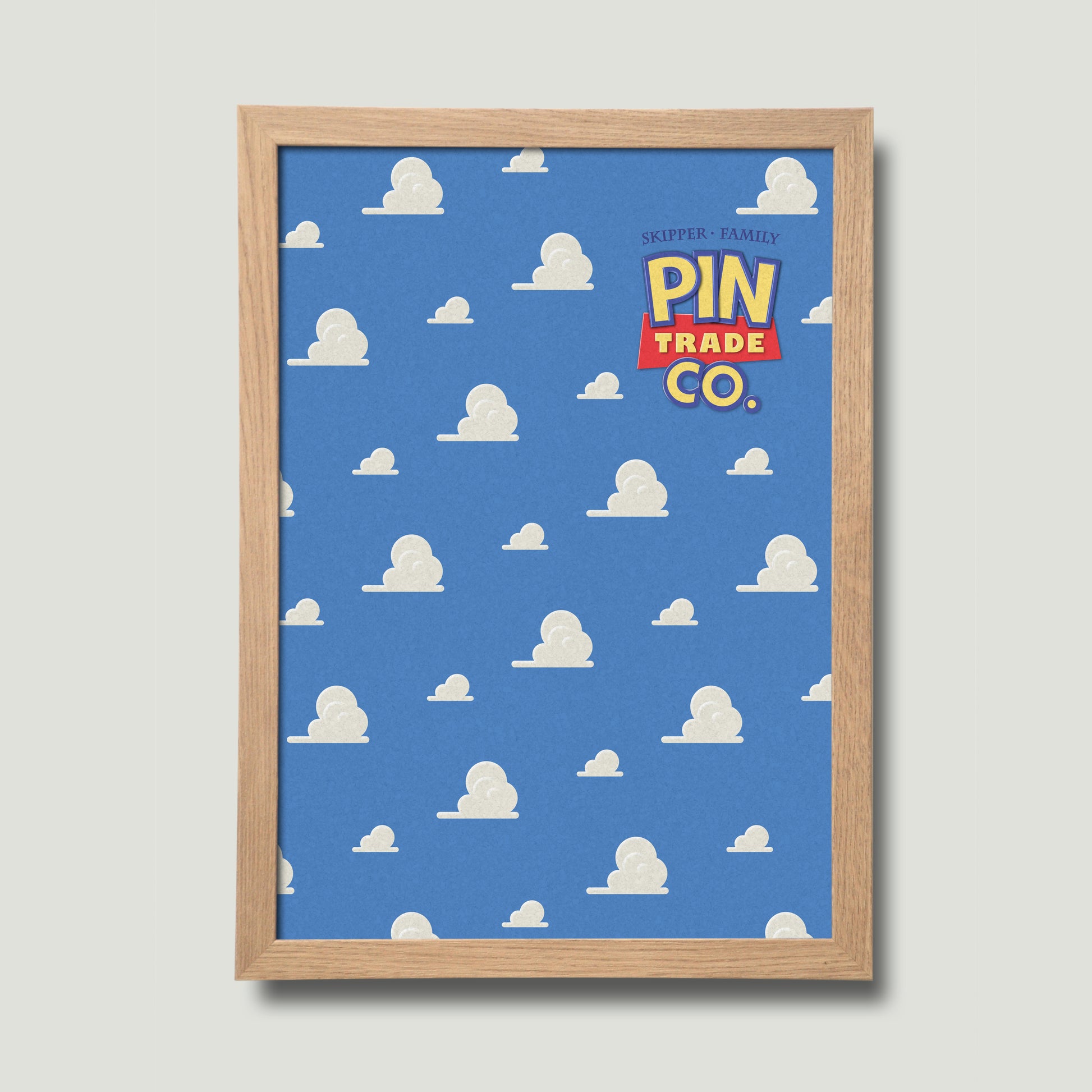 framed in natural wood, cork pin trading board displays andys room wallpaper in the background.