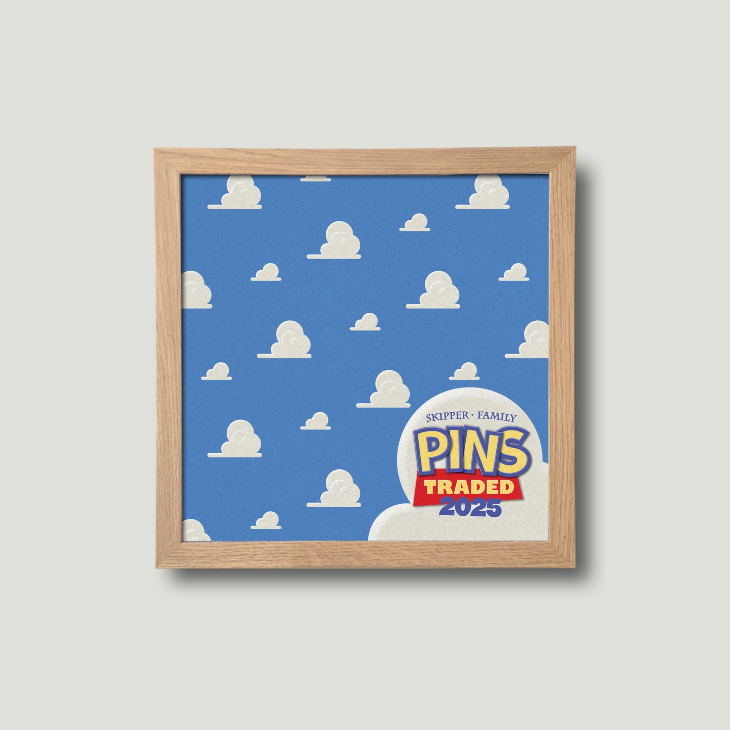 Square cork pin board, framed in natural wood with Disney inspired pattern.
